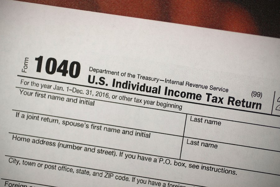 A copy of a IRS 1040 tax form is seen at an H&R Block office in this Dec. 22, 2017 photo. (Credit: Joe Raedle/Getty Images)