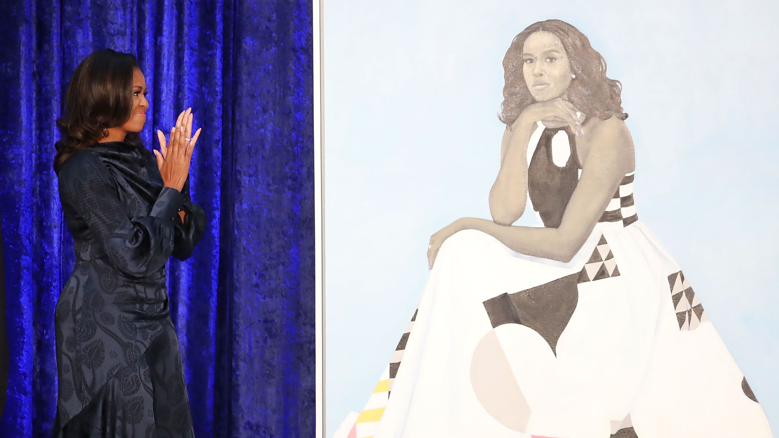 Former U.S. first lady Michelle Obama looks at her newly unveiled portrait during a ceremony at the Smithsonian's National Portrait Gallery on Feb. 12, 2018 in Washington, D.C. (Credit: Mark Wilson/Getty Images)