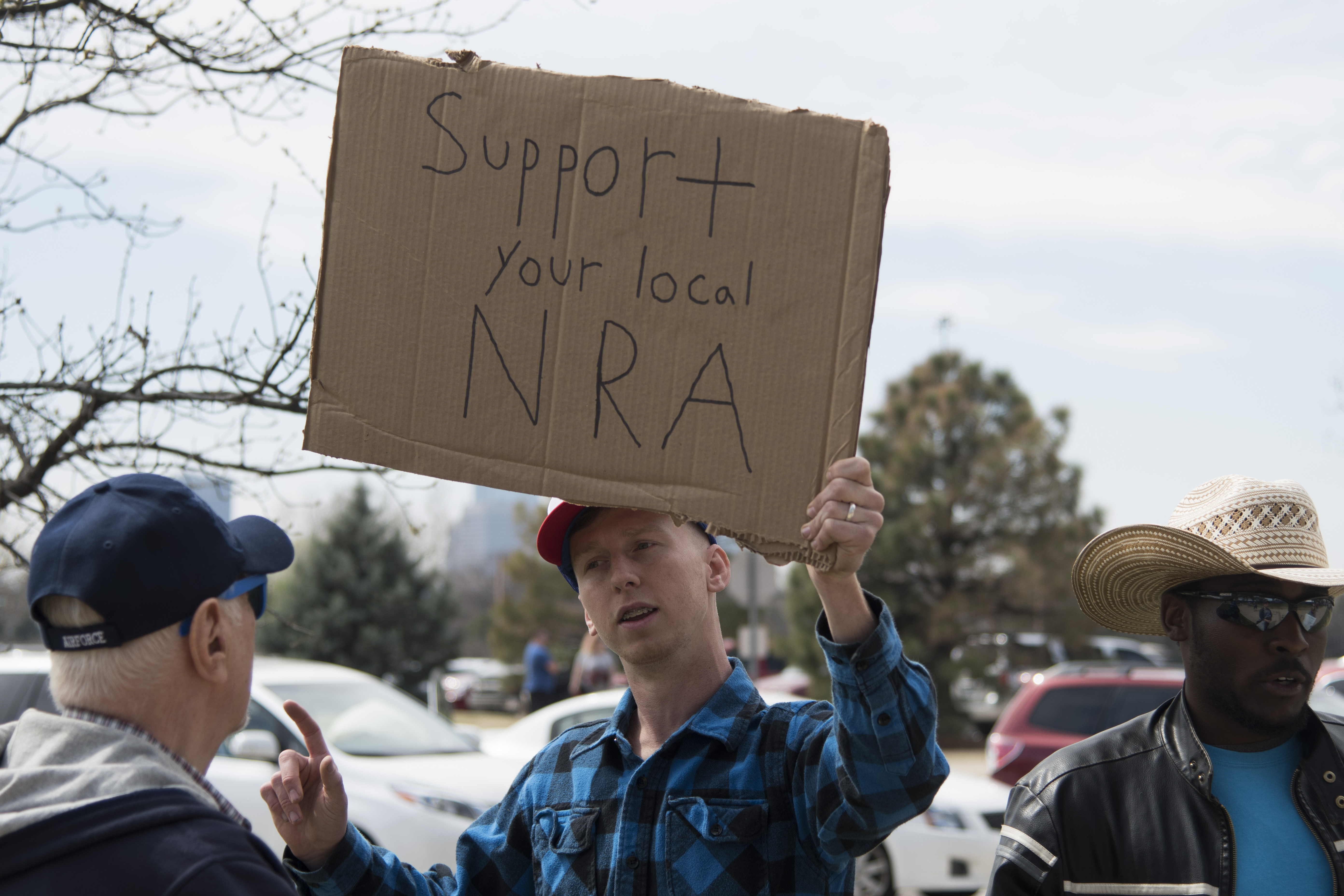 Pro-gun advocate Trevor Jackson talks to an anti-gun supporter during the March for Our Lives rally on March 24, 2018, in Oklahoma City. (Credit: J. Pat Carter/Getty Images)