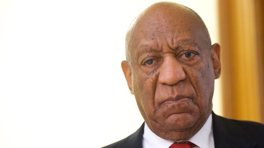 Bill Cosby walks after it was announced a verdict is in at the Montgomery County Courthouse for day 14 of his sexual assault retrial on April 26, 2018 in Norristown, Pennsylvania.. (Credit: Mark Makela/Getty Images)