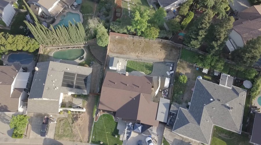 Holes are seen in the Citrus Heights backyard of suspected serial killer Joseph James DeAngelo on April 26, 2018, as investigators comb the property following his arrest. (Credit: KTXL)