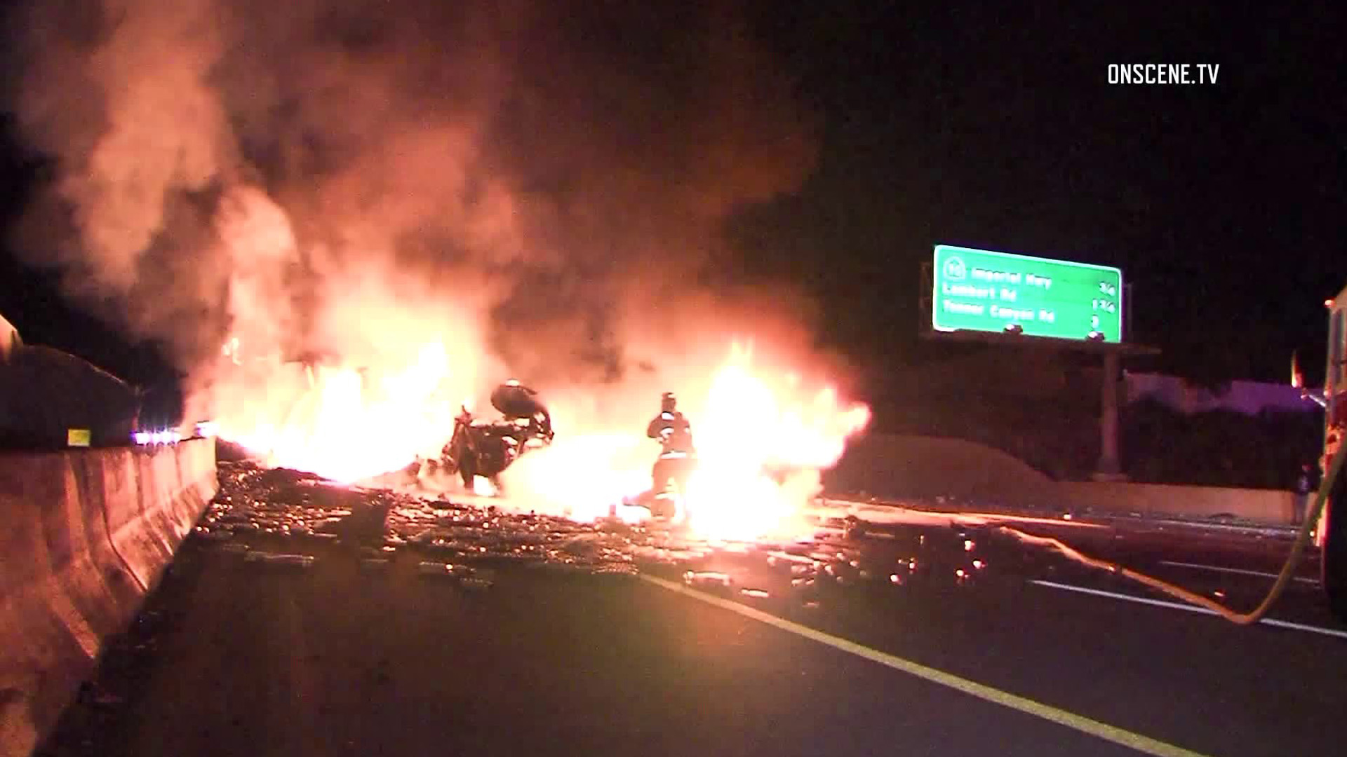 A big rig overturned on the 57 Freeway near the Imperial Highway on April 17, 2018. (Credit: Onscene.tv/KTLA)