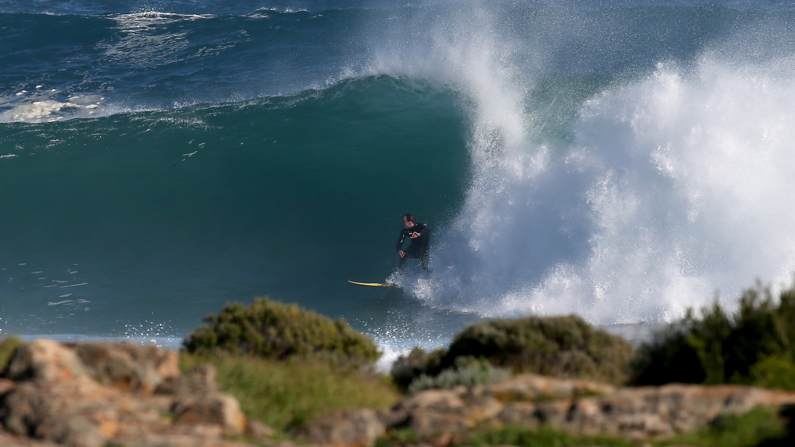 A surfer rides a wave at North Point on June 27, 2015 in Gracetown, Australia. (Credit: Paul Kane/Getty Images)