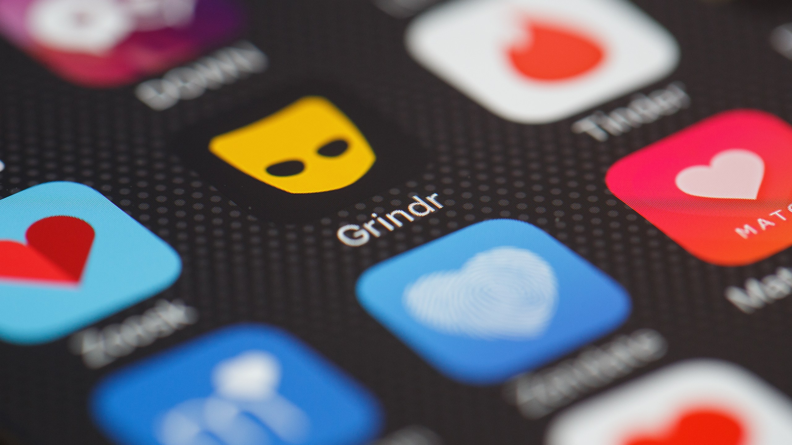 The "Grindr" app logo is seen amongst other dating apps on a mobile phone screen on Nov. 24, 2016 in London, England. (Credit: Leon Neal/Getty Images)