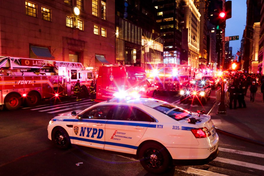 NYPD officers and first responders assess the scene of a fire at Trump Tower on April 7, 2018 in New York City. (Credit: Eduardo Munoz Alvarez/Getty Images)