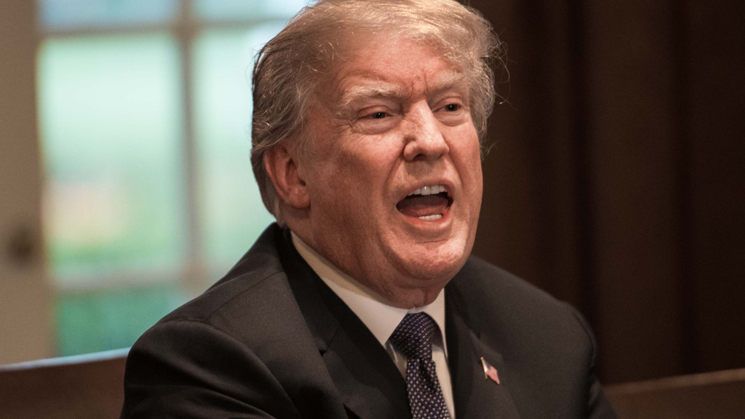 Donald Trump speaks during a meeting with senior military leaders at the White House on April 9, 2018. (Credit: Nicholas Kamm/AFP/Getty Images)