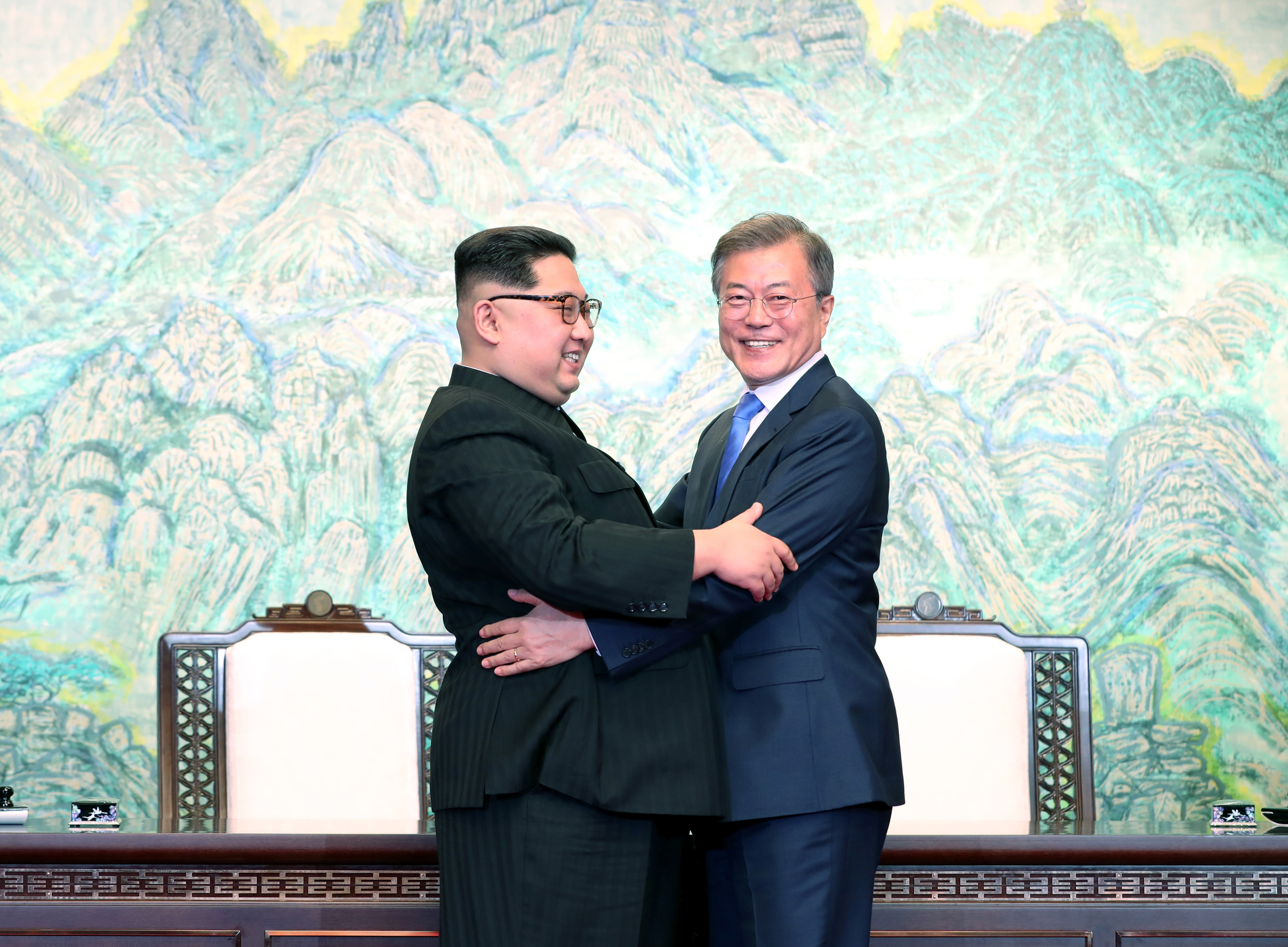 North Korean leader Kim Jong Un and South Korean President Moon Jae-in embrace after signing the Panmunjom Declaration for Peace, Prosperity and Unification of the Korean Peninsula on April 27, 2018. (Credit: Korea Summit Press Pool/Getty Images)