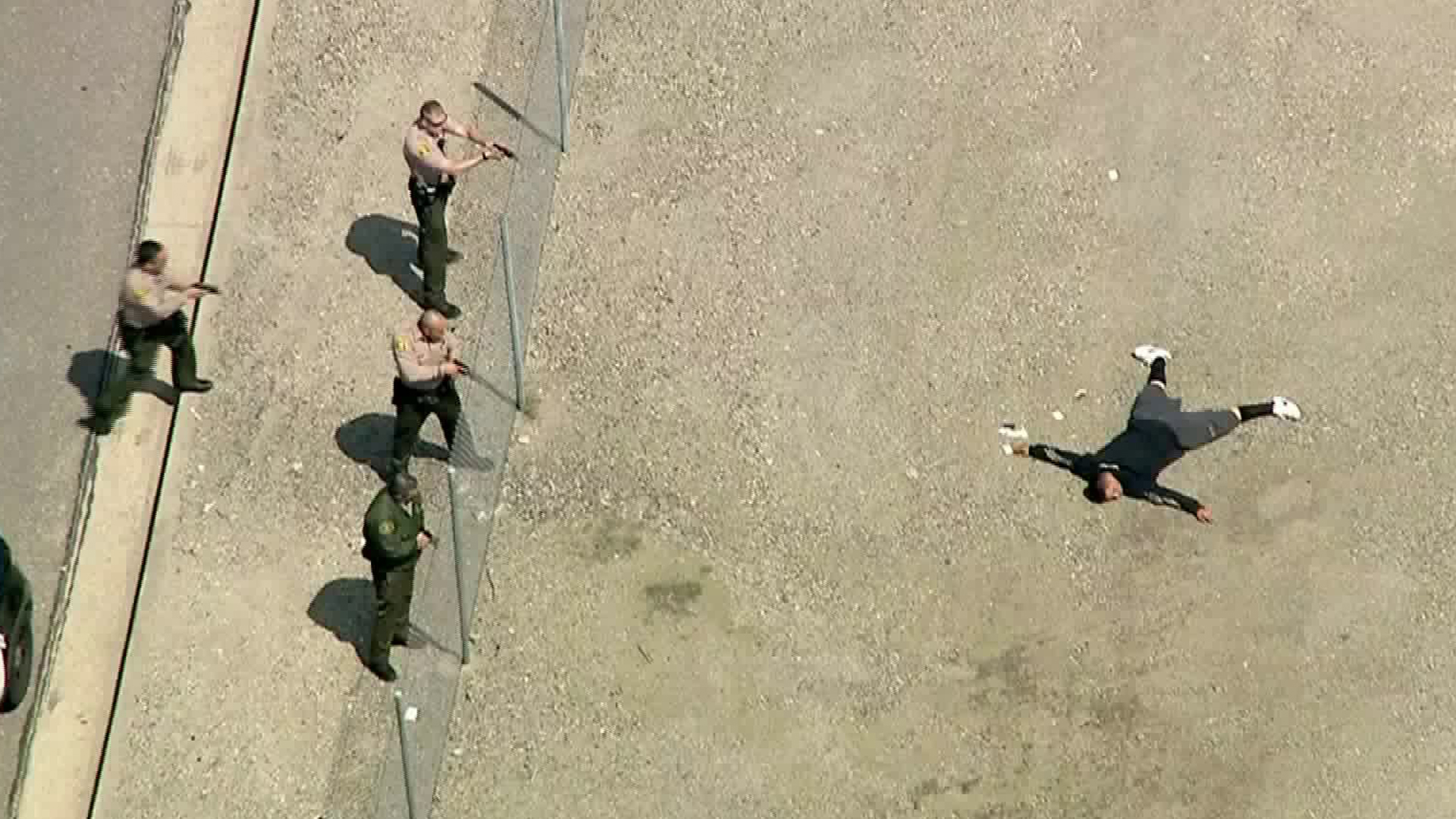 A man is seen being taken into custody after a pursuit in Santa Clarita on April 2, 2018. (Credit: KTLA)