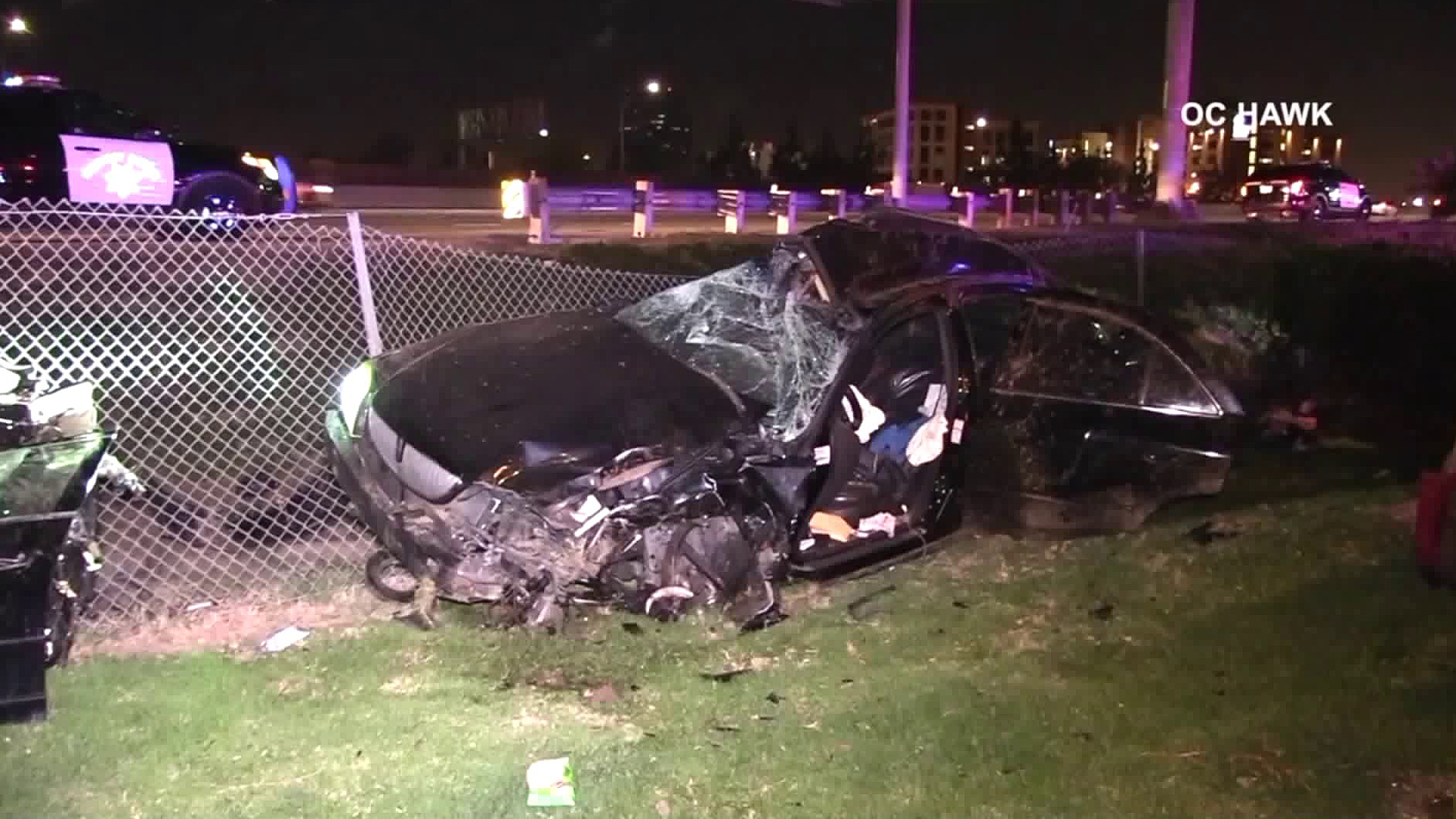 A car landed in a Motel 6 parking lot after flying off a freeway in Orange on April 8, 2018. (Credit: OC Hawk)