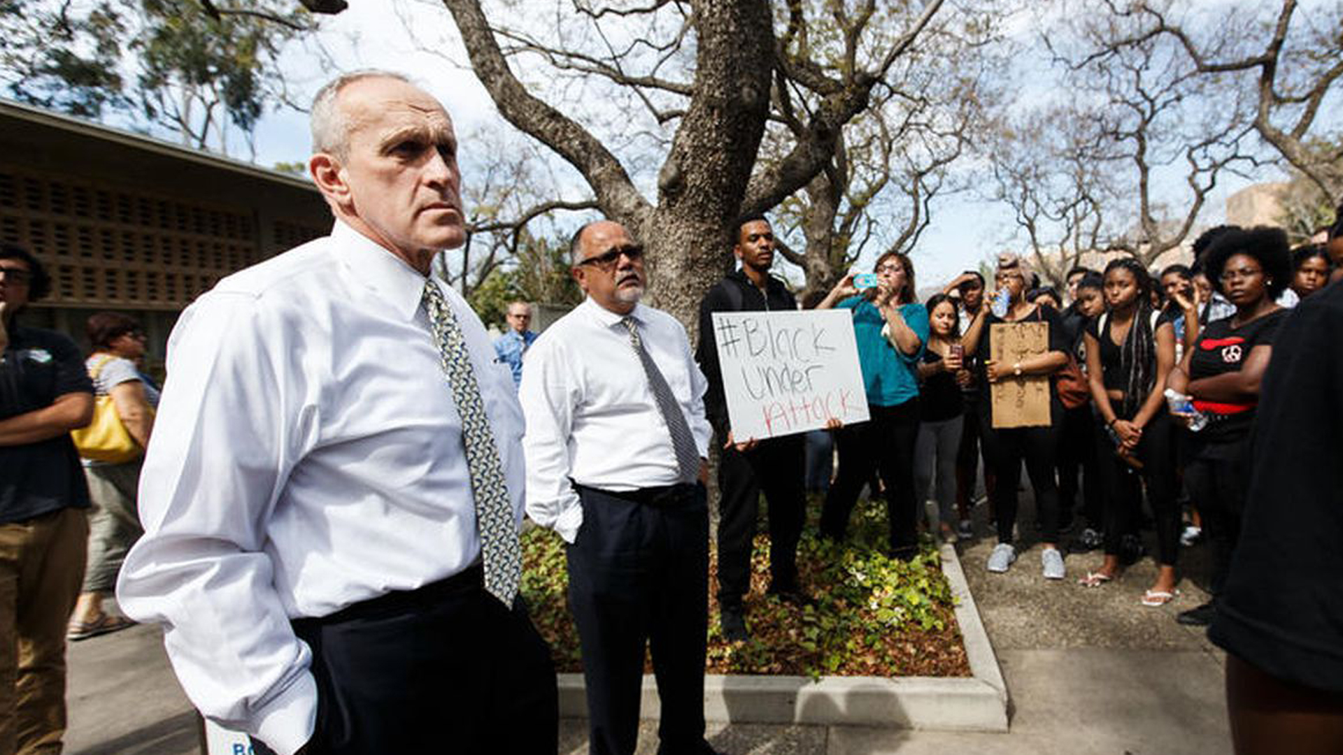 UC Riverside Chancellor Kim Wilcox, far left, is confronted by protesters against racial injustice and police brutality, including members of the Black Student Union. (Credit: Marcus Yam / Los Angeles Times)