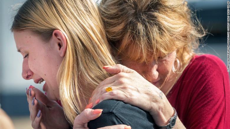 Santa Fe High School student Dakota Shrader is comforted by her mother Susan Davidson following a shooting at the school on Friday, May 18, 2018, in Santa Fe, Texas. Shrader said her friend was shot in the incident. (Credit: Stuart Villanueva/The Galveston County Daily News via AP)