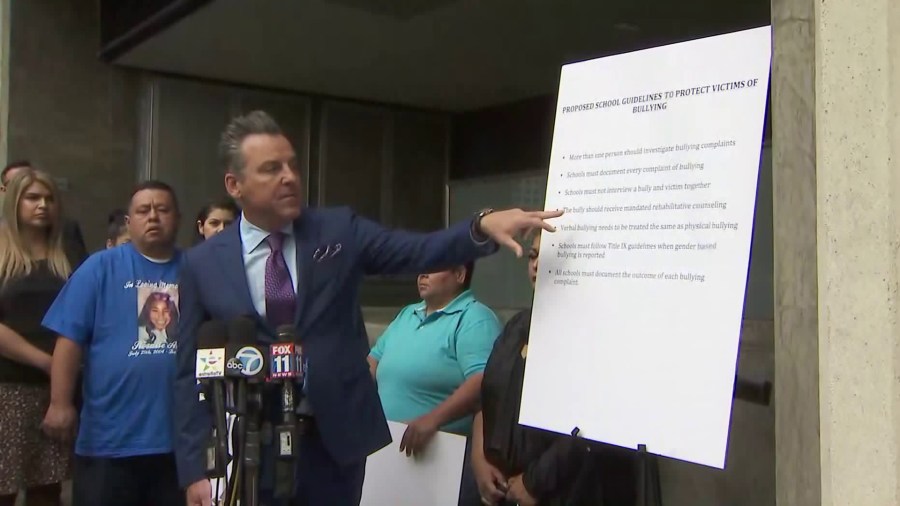 Brian Claypool speaks alongside families he is representing in bullying cases against school districts on May 15, 2018. (Credit: KTLA)