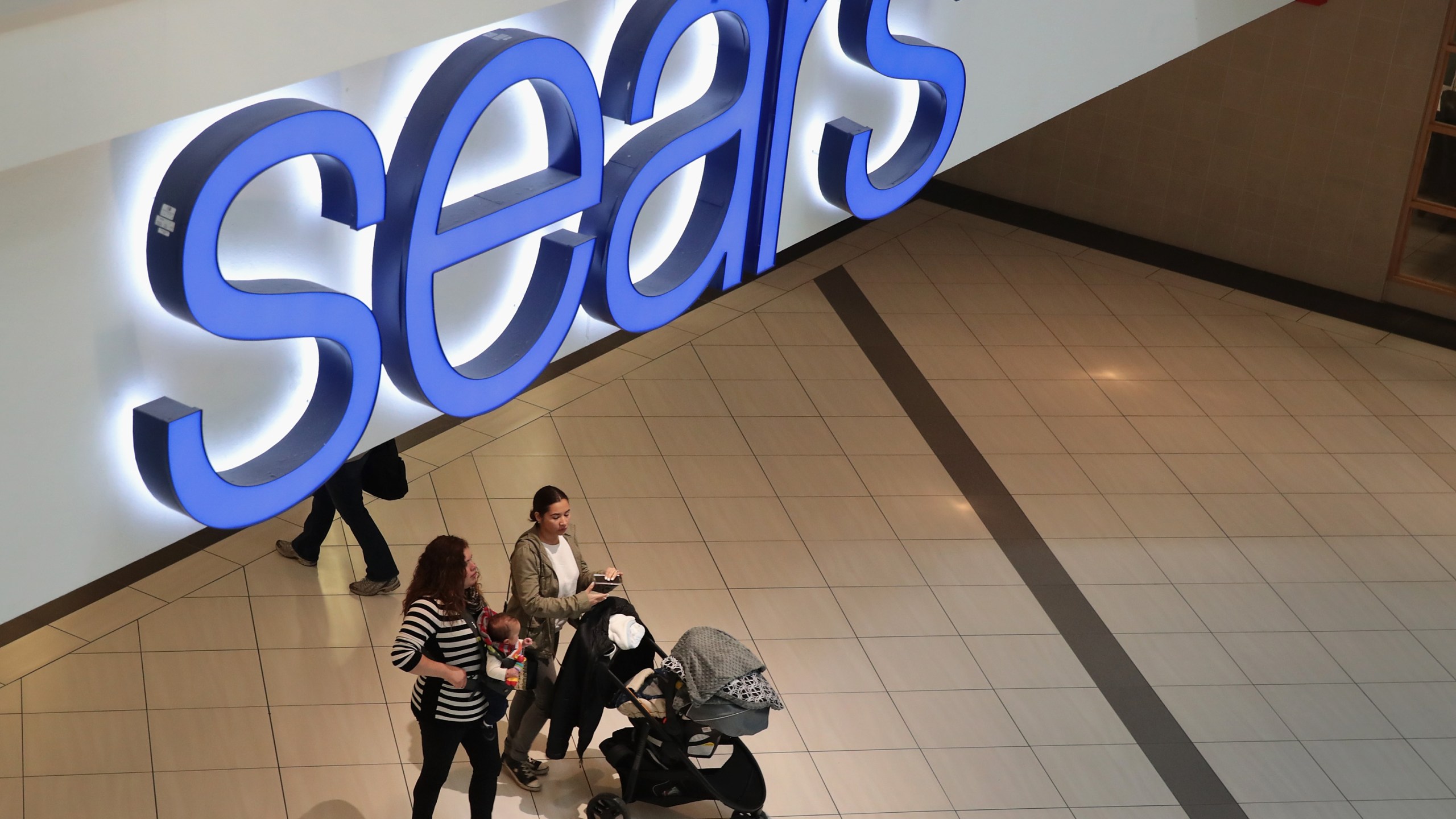 People shop at a Sears store on March 22, 2017 in Schaumburg, Illinois. (Credit: Scott Olson/Getty Images)