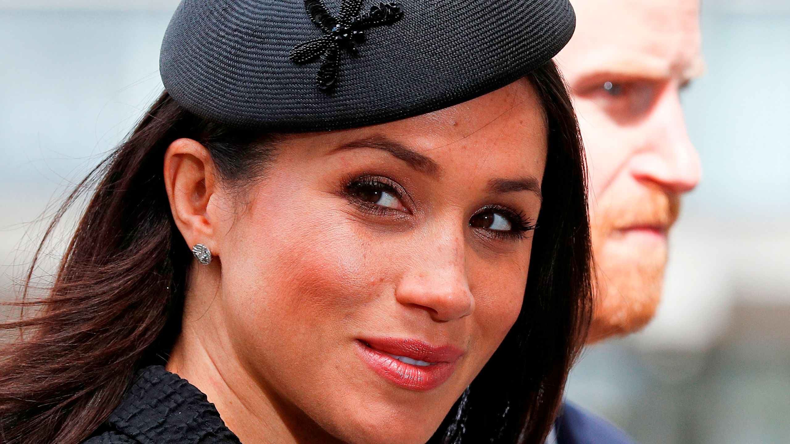 Meghan Markle arrives with her fiance Prince Harry to attend a service of commemoration on Anzac Day in Westminster Abbey in London on April 25, 2018. (Credit: Adrian Dennis / AFP / Getty Images)