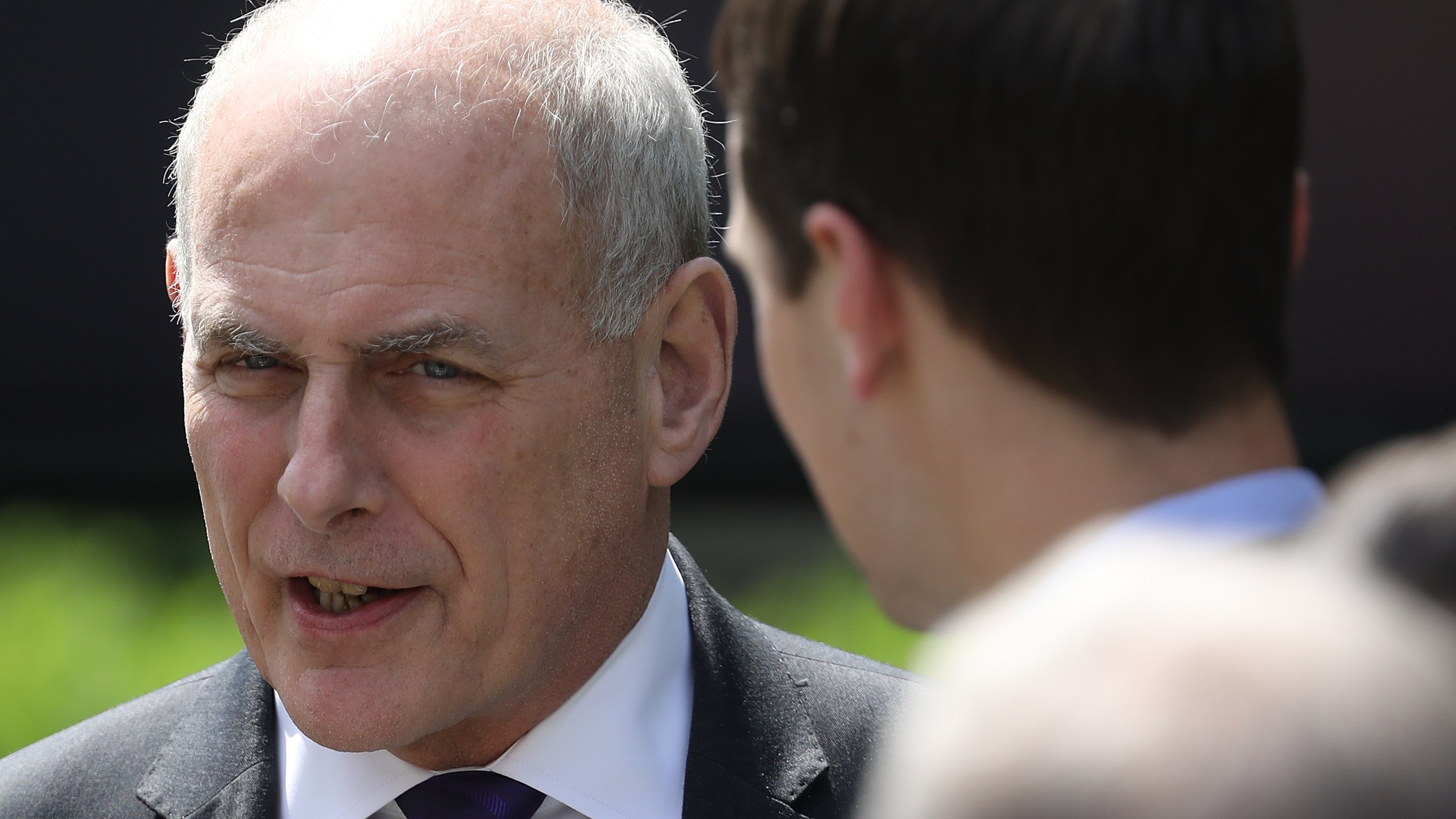 White House Chief of Staff John Kelly, left, speaks with senior White House adviser Jared Kushner at an event where Melania Trump spoke in the Rose Garden of the White House, May 7, 2018. (Credit: Win McNamee / Getty Images)