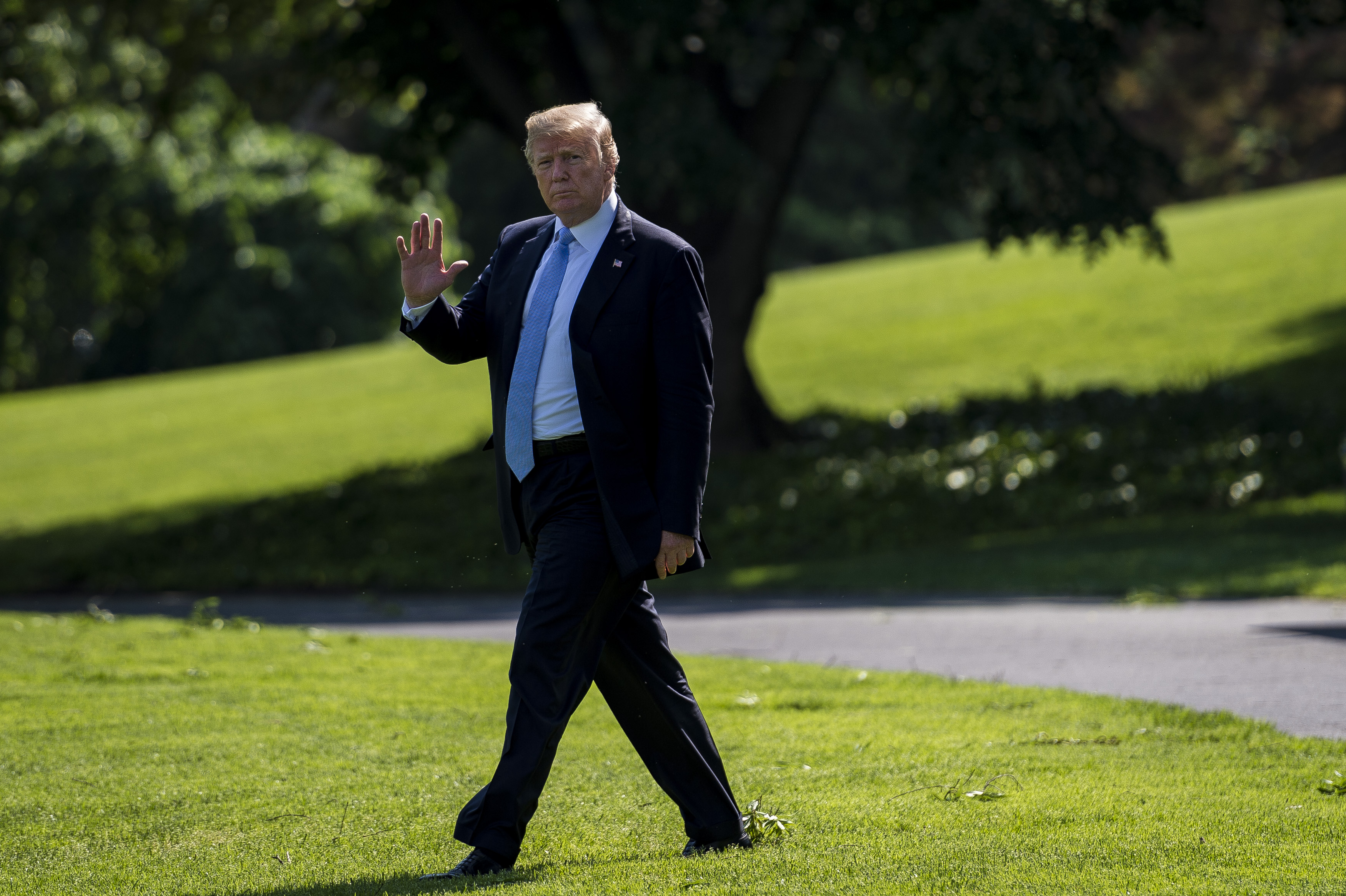 Donald Trump waves to the media on his way from the Oval Office to Marine One on May 15, 2018. (Credit: Pete Marovich-Pool/Getty Images)