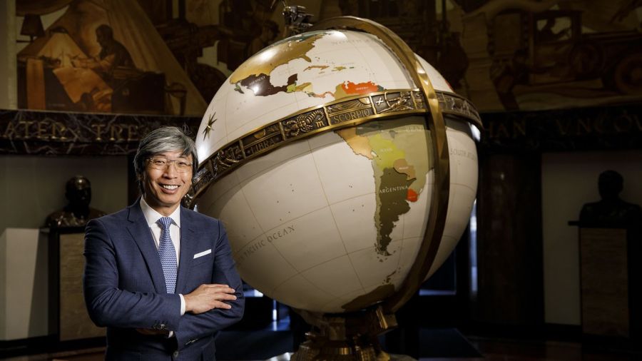 Dr. Patrick Soon-Shiong stands in front of a globe in an undated photo. (Credit: Marcus Yam / Los Angeles Times)