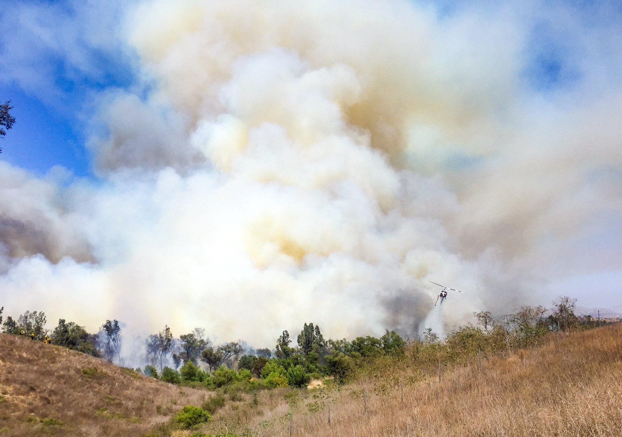 The Corona Fire Department released this photo of a brush fire burning near the border with Chino Hills on June 12, 2018.