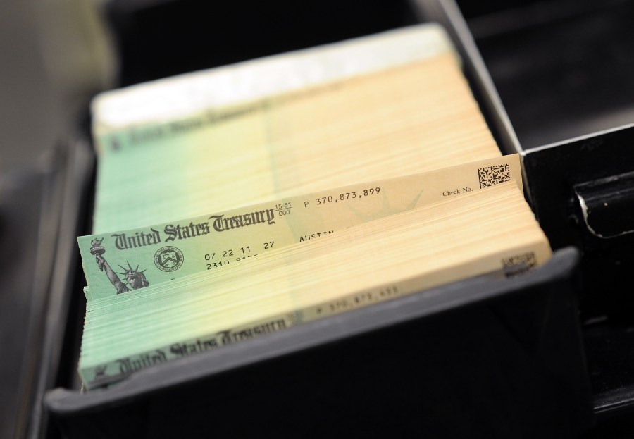 In this photo illustration, U.S. Treasury checks are piled at the U.S. Treasury printing facility on July 18, 2011, in Philadelphia, Pennsylvania. (Credit: William Thomas Cain/Getty Images)