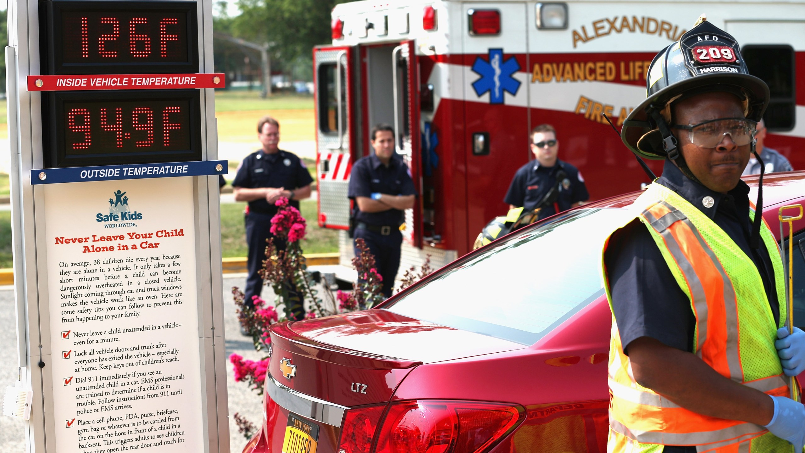 Fire and EMS officials participate in a demonstration of the dangers of leaving children unattended in vehicles during a news conference in Alexandria, Virginia. (Credit: Chip Somodevilla/Getty Images)