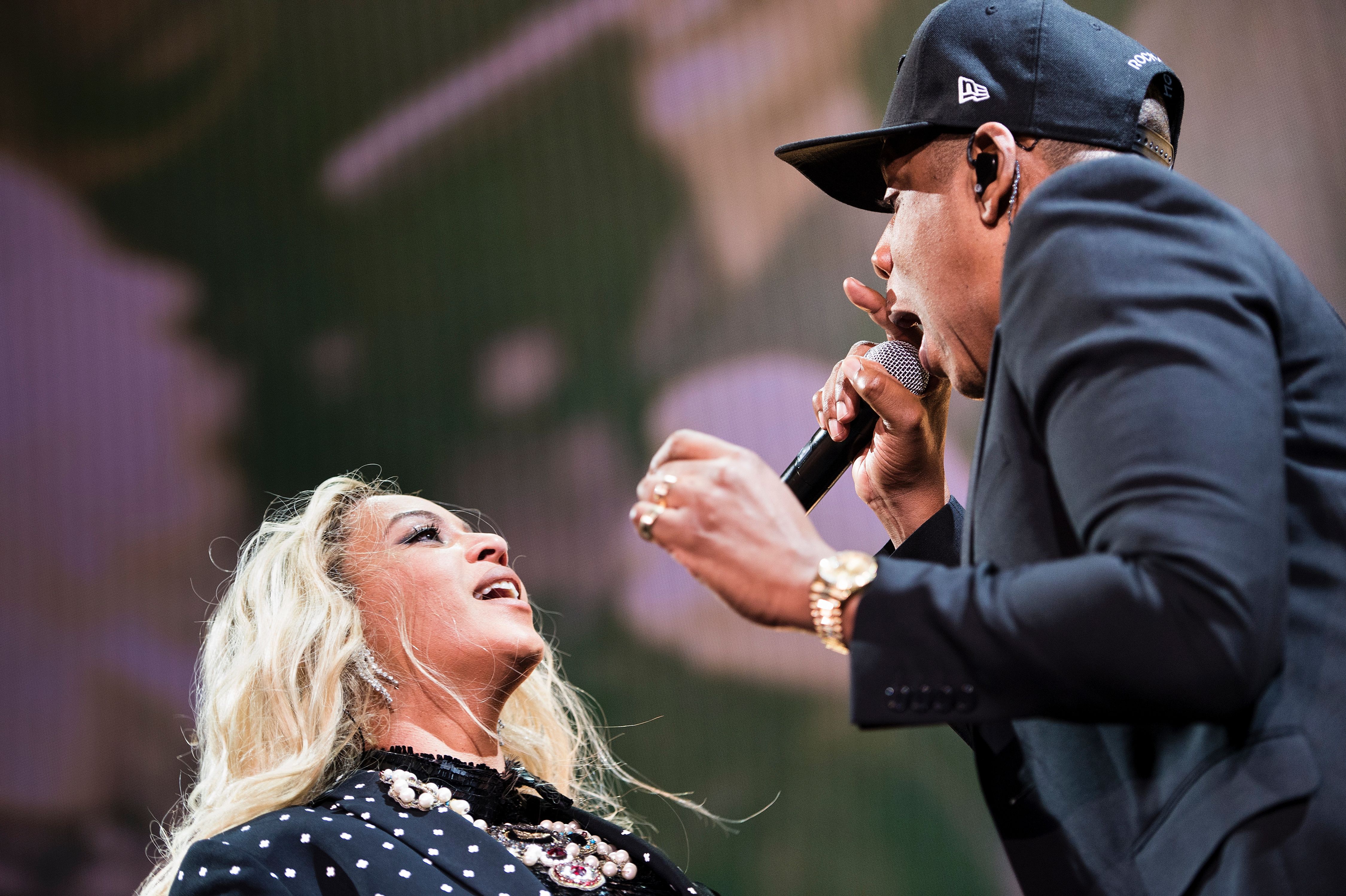 Beyonce and Jay-Z perform during a Get Out the Vote (GOTV) performance in support of Democratic presidential nominee Hillary Clinton at the Wolstein Center Nov. 4, 2016, in Cleveland, Ohio. (Credit: BRENDAN SMIALOWSKI/AFP/Getty Images)