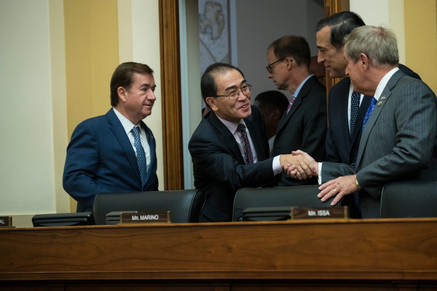 Southern California Republicans Ed Royce, left, and Darrell Issa, second from right, speak to Thae Yong-ho and Rep. Joe Wilson, R-SC, on Capitol Hill in Washington, D.C,. on Nov. 1, 2017. (Credit: JIM WATSON/AFP/Getty Images)