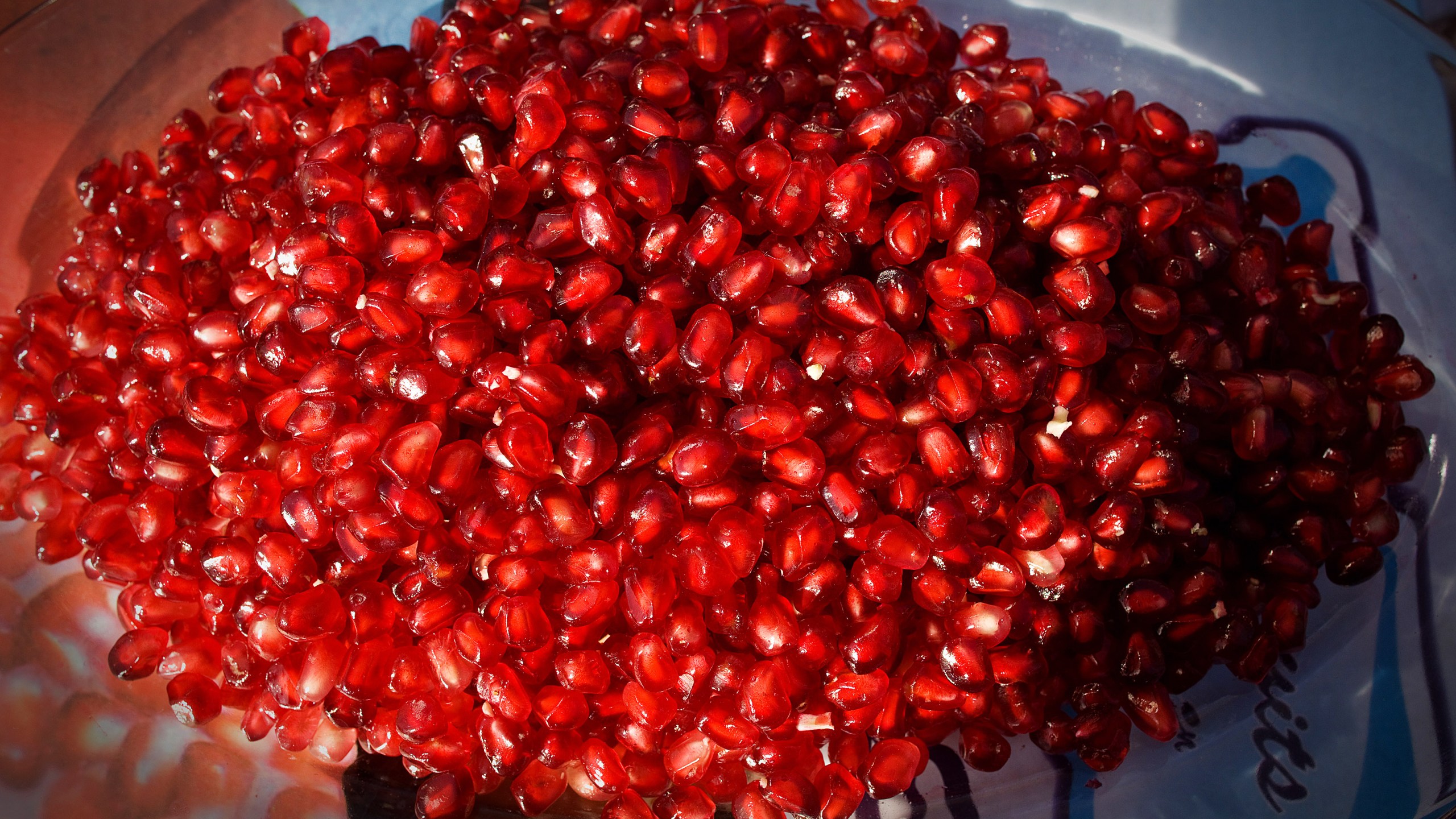 Pomegranates seeds are displayed on a plate in this file photo. (Credit: Paula Bronstein/Getty Images)