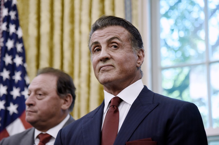 Sylvester Stallone looks on during a signing ceremony to grant of Clemency for former heavyweight champion Jack Johnson in the Oval Office of the White House on May 24, 2018 in Washington, D.C. (Credit: Olivier Douliery-Pool/Getty Images)