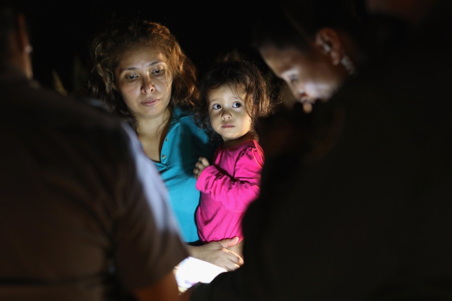 Central American asylum seekers, including a Honduran girl, 2, and her mother, are taken into custody near the U.S.-Mexico border on June 12, 2018, in McAllen, Texas. (Credit: John Moore / Getty Images)