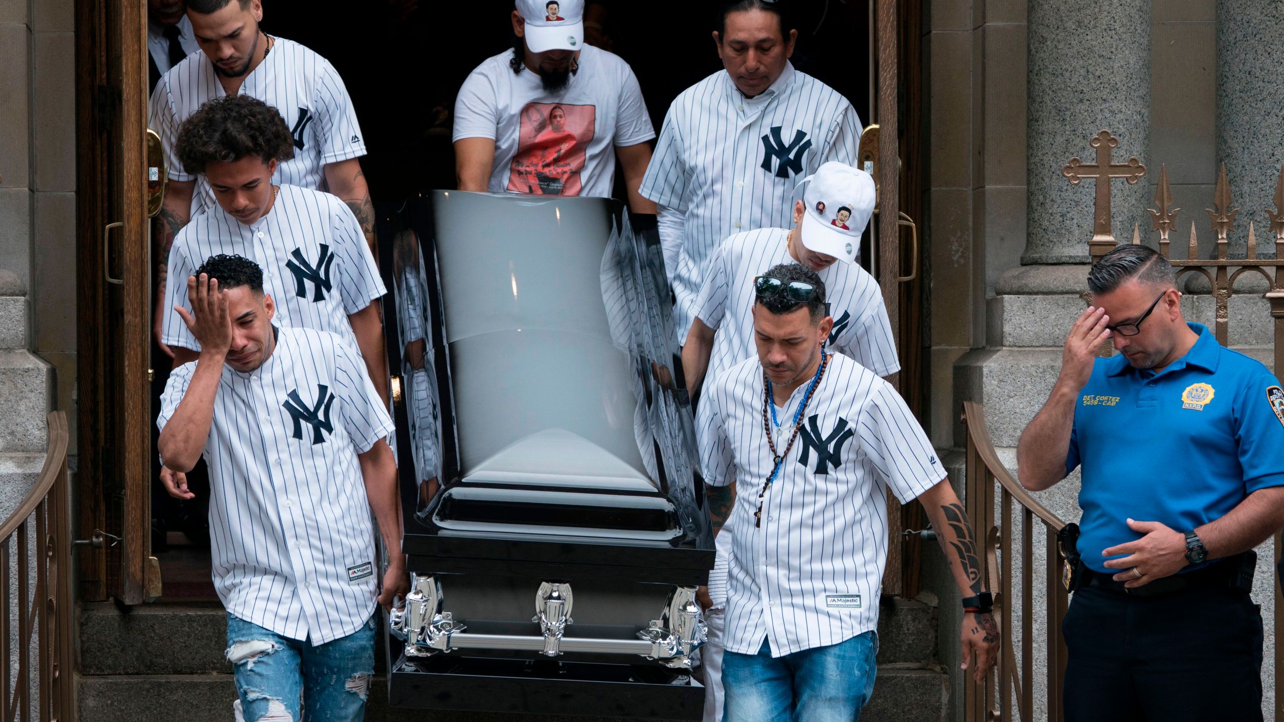 The body of of Lesandro "Junior" Guzman-Feliz is taken from the Our Lady of Mount Carmel church in the Bronx after funeral services on June 27, 2018. (Credit: Don Emmert / AFP / Getty Images)