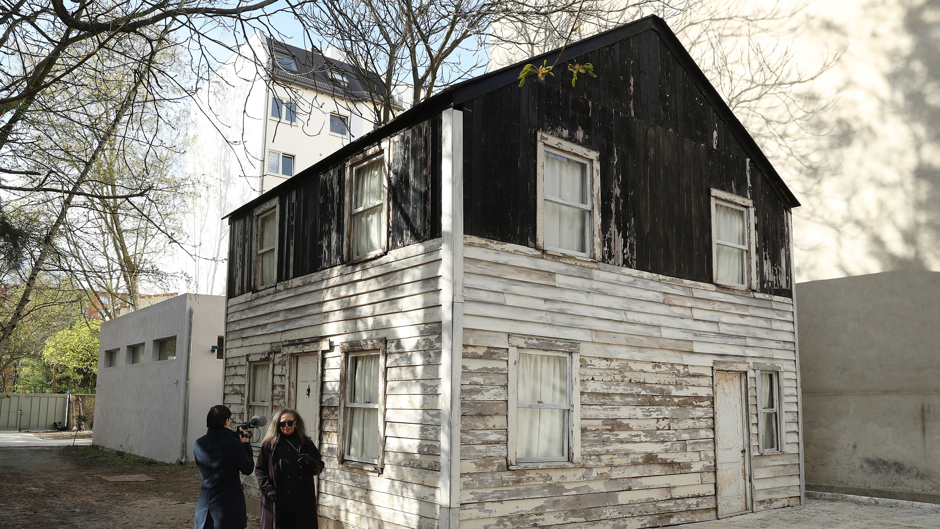 Rhea McCauley, niece of African American human rights figure Rosa Parks, speaks to a journalist while standing next to the former house of Rosa Parks on property of U.S. artist Ryan Mendoza on April 6, 2017, in Berlin, Germany. (Credit: Sean Gallup/Getty Images)