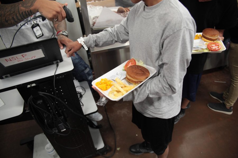 A child receives a meal at the Casa Padre shelter in Brownsville, Texas, in an undated photo released by the Department of Health and Human Services.