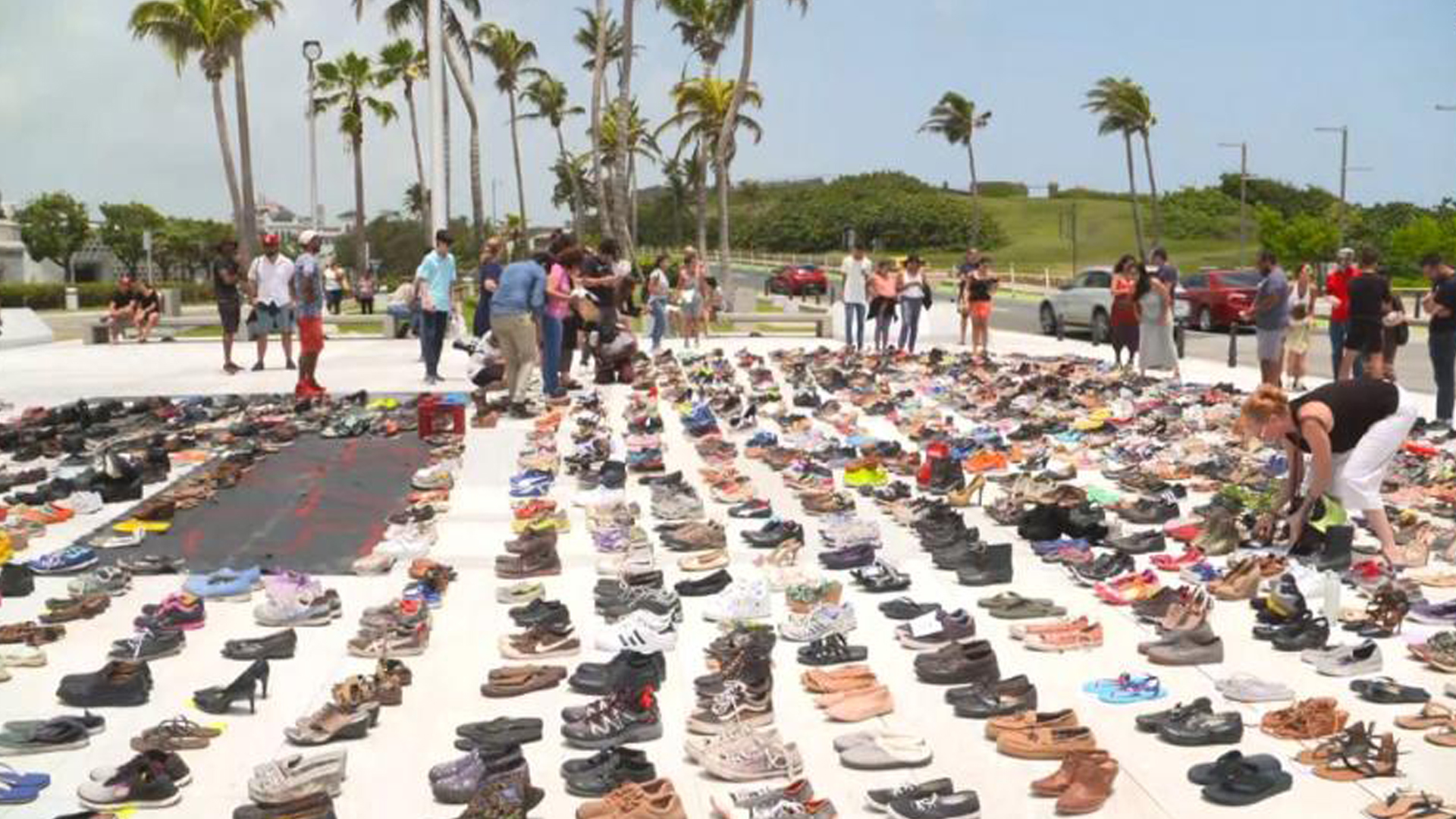 Hundreds of shoes are used to create a makeshift memorial for the victims of Hurricane Maria on June 2, 2018. (Credit: CNN)