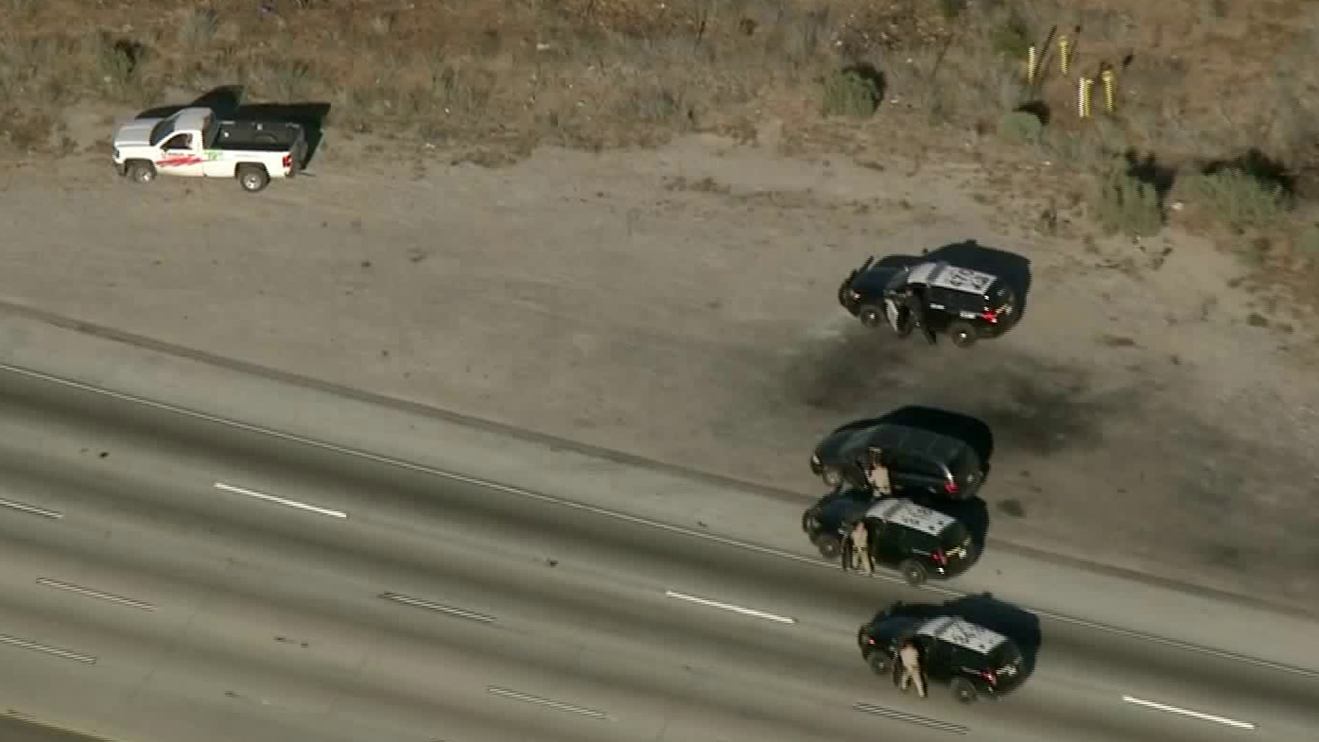 Authorities approach a U-Haul truck following a chase across the Inland Empire on June 13, 2018. (Credit: KTLA)