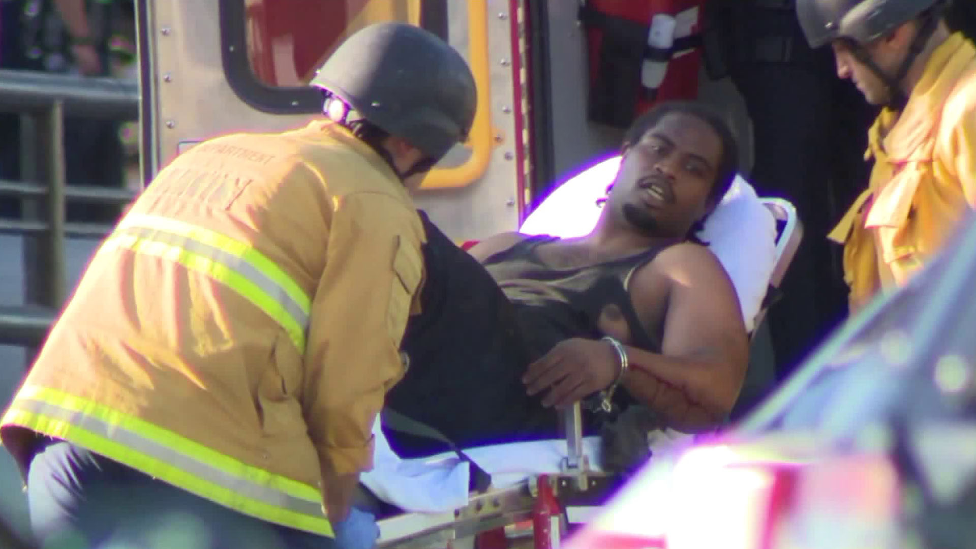 Officials wheel Gene Atkins into an ambulance after a deadly standoff with police at a Trader Joe's in Silver Lake on July 21, 2018. (Credit: KTLA)