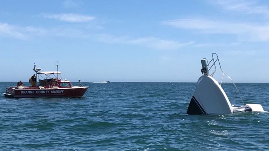 The Orange County Sheriff Department's Harbor Patrol responds to a sinking boat off Newport Beach on July 22, 2018. (Credit: Orange County Sheriff's Department)