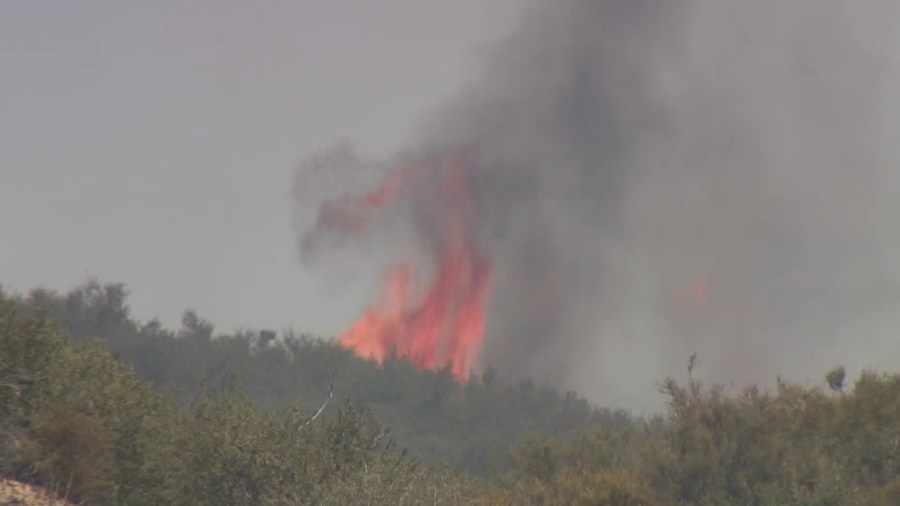 A blaze burns near the Cajon Pass in San Bernardino County on July 6, 2018. (Credit: KTLA)