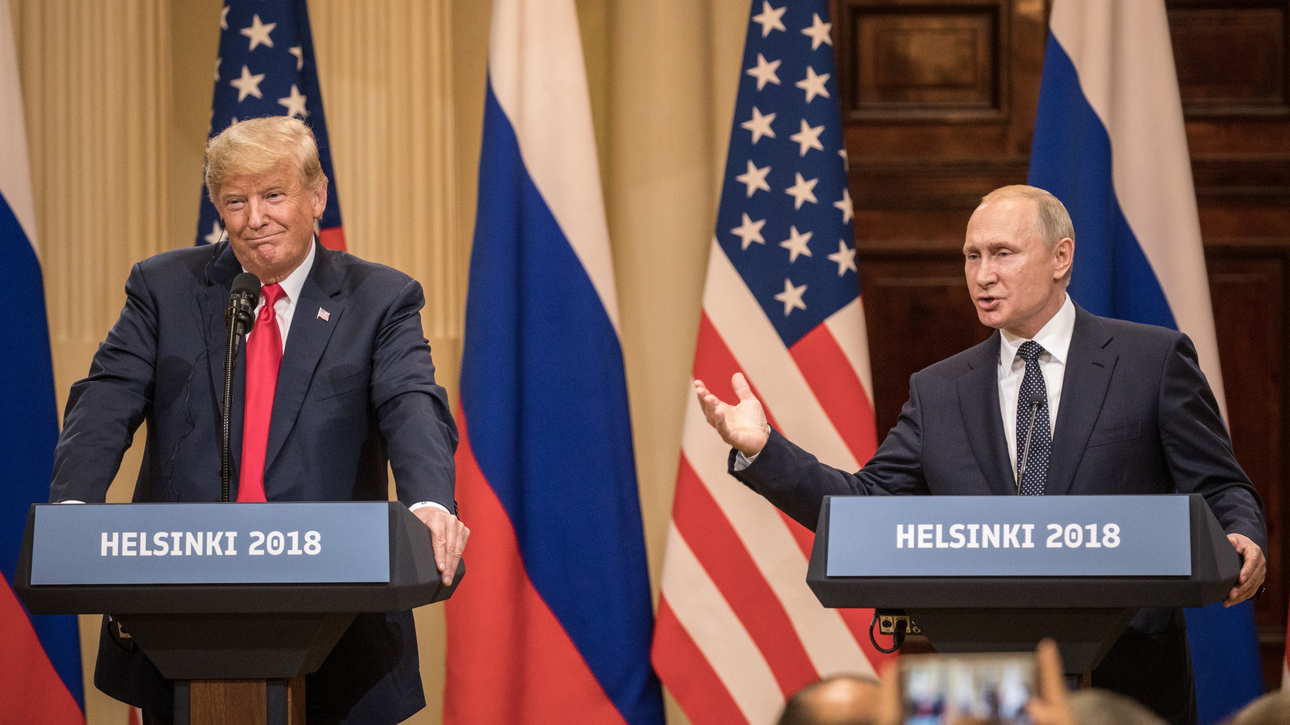 U.S. President Donald Trump, left, and Russian President Vladimir Putin answer questions about the 2016 U.S Election collusion during a joint press conference after their summit on July 16, 2018, in Helsinki, Finland. (Credit: Chris McGrath/Getty Images)