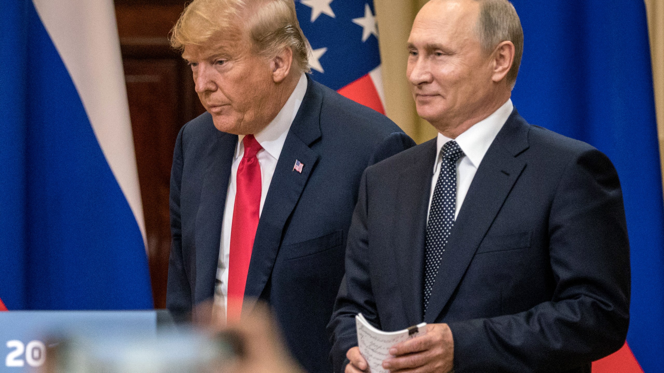 U.S. President Donald Trump, left, and Russian President Vladimir Putin arrive to waiting media during a joint press conference after their summit on July 16, 2018, in Helsinki, Finland. (Credit: Chris McGrath/Getty Images)