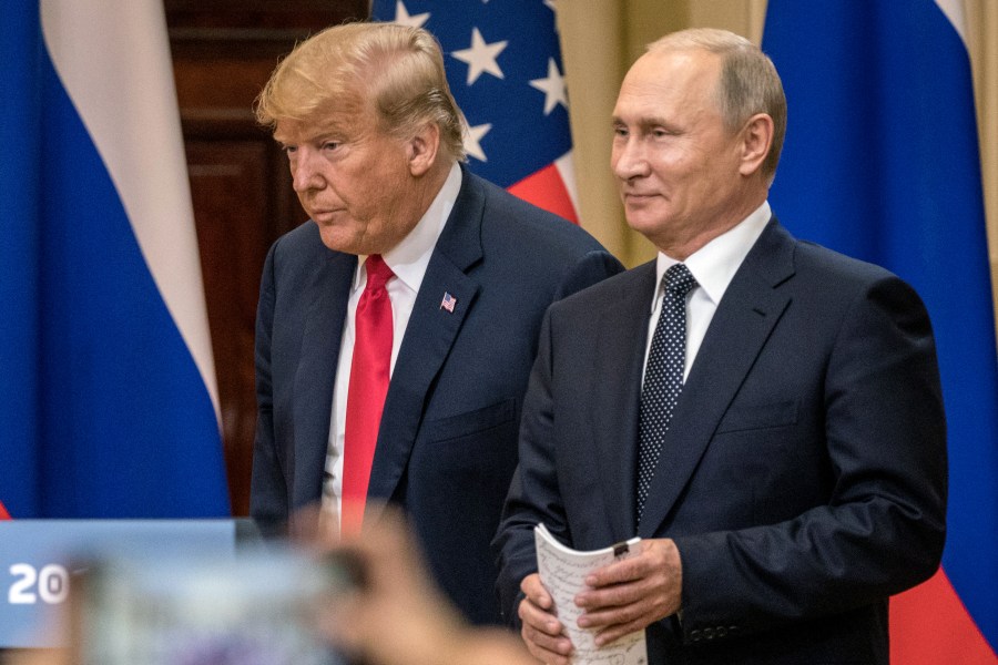 U.S. President Donald Trump, left, and Russian President Vladimir Putin arrive to waiting media during a joint press conference after their summit on July 16, 2018, in Helsinki, Finland. (Credit: Chris McGrath/Getty Images)