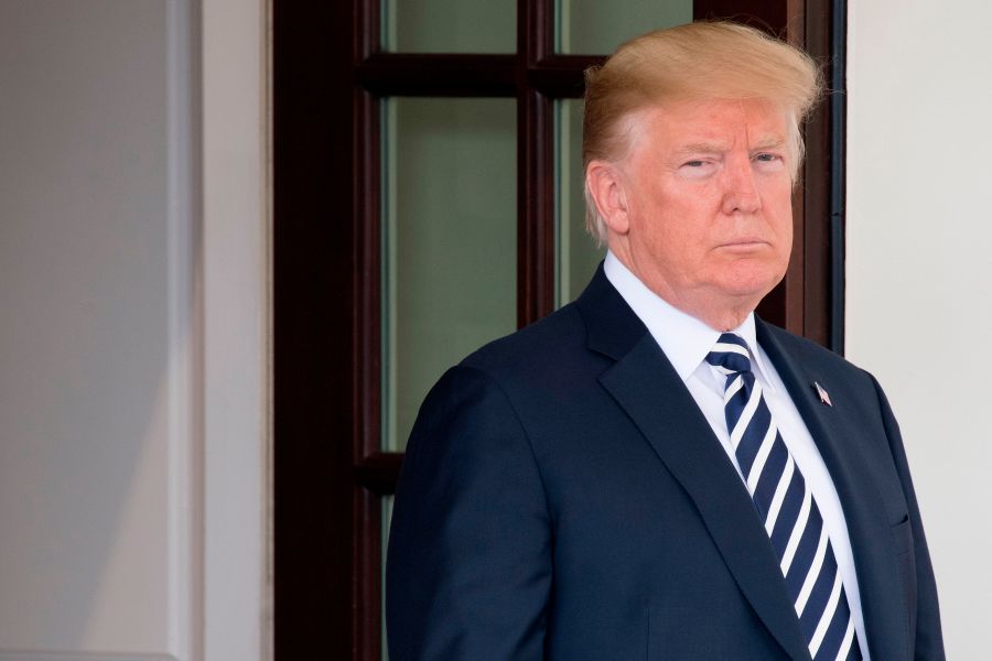 Donald Trump awaits the arrival of Italian Prime Minister Giuseppe Conte at the White House on July 30, 2018. (Credit: Jim Watson/AFP/Getty Images)