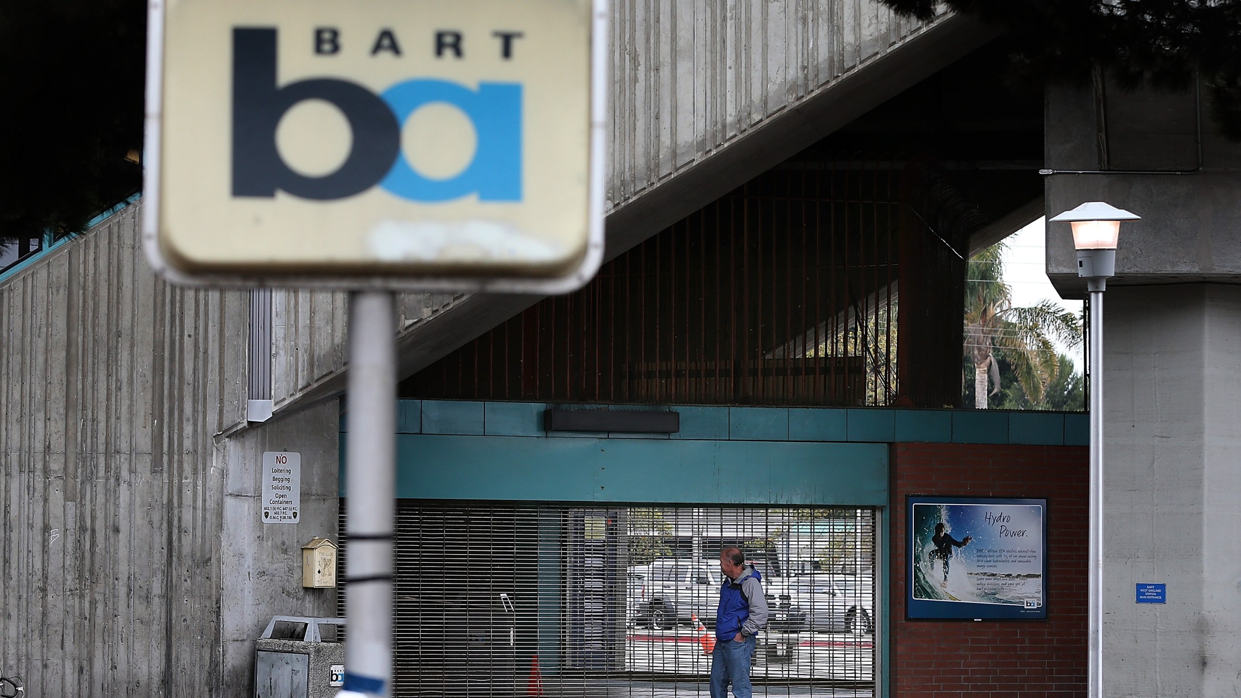 A man looks into the shuttered Bay Area Rapid Transit (BART) West Oakland station on October 21, 2013 in Oakland, California. (Credit: Justin Sullivan/Getty Images)