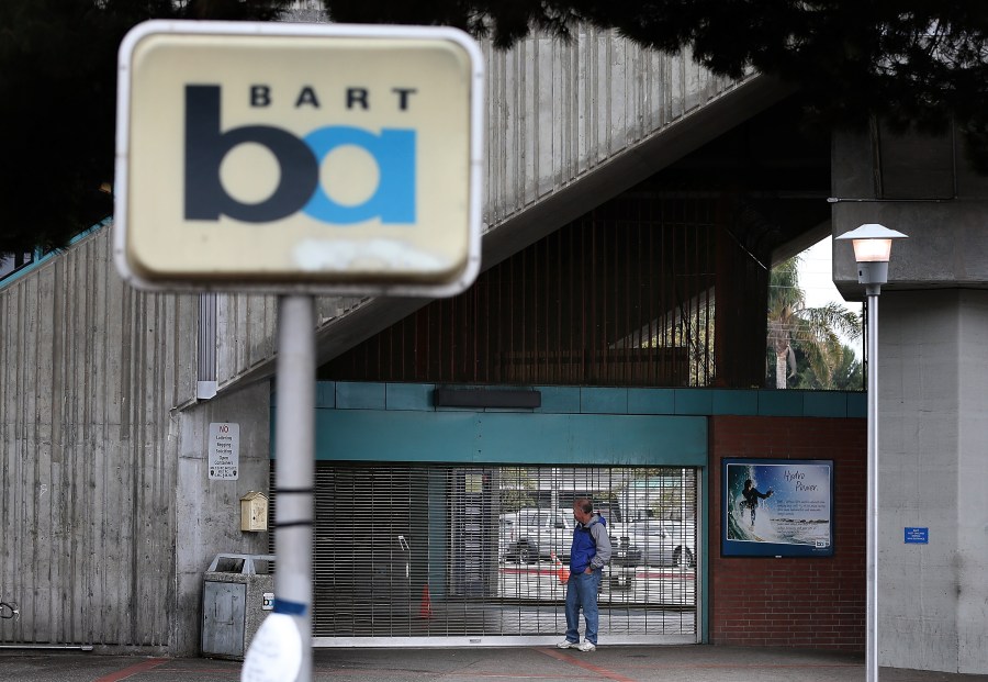 A man looks into the shuttered Bay Area Rapid Transit (BART) West Oakland station on October 21, 2013 in Oakland, California. (Credit: Justin Sullivan/Getty Images)