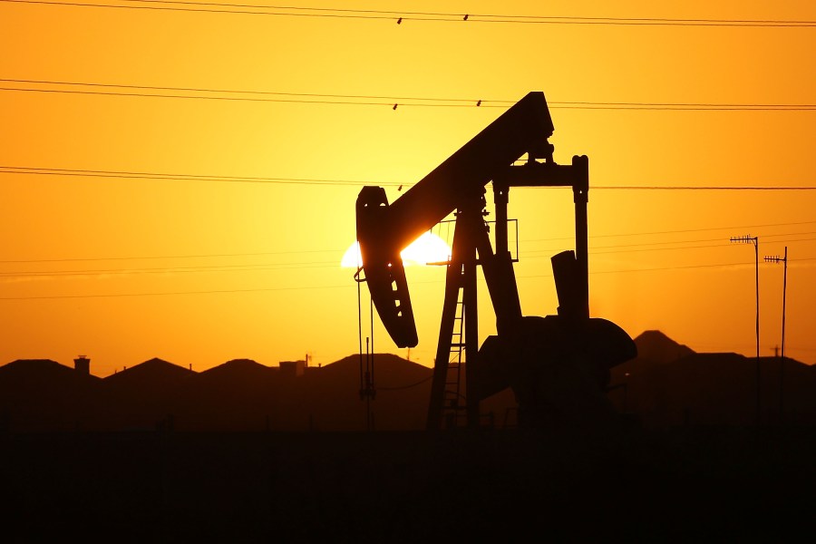 A pump jack sits on the outskirts of town at dawn in the Permian Basin oil field on January 21, 2016 in the oil town of Midland, Texas. (Credit: Spencer Platt/Getty Images)