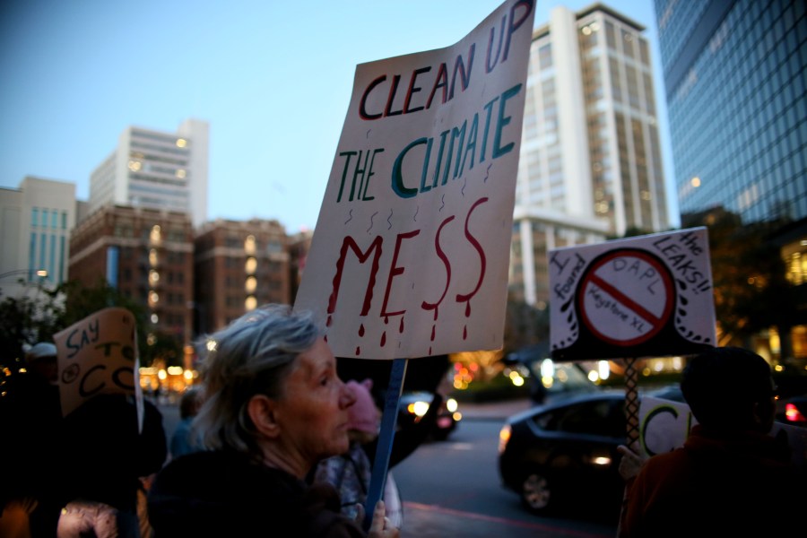 Protesters chant during a rally against climate change in San Diego on Feb. 21, 2017. (Credit: SANDY HUFFAKER/AFP/Getty Images)