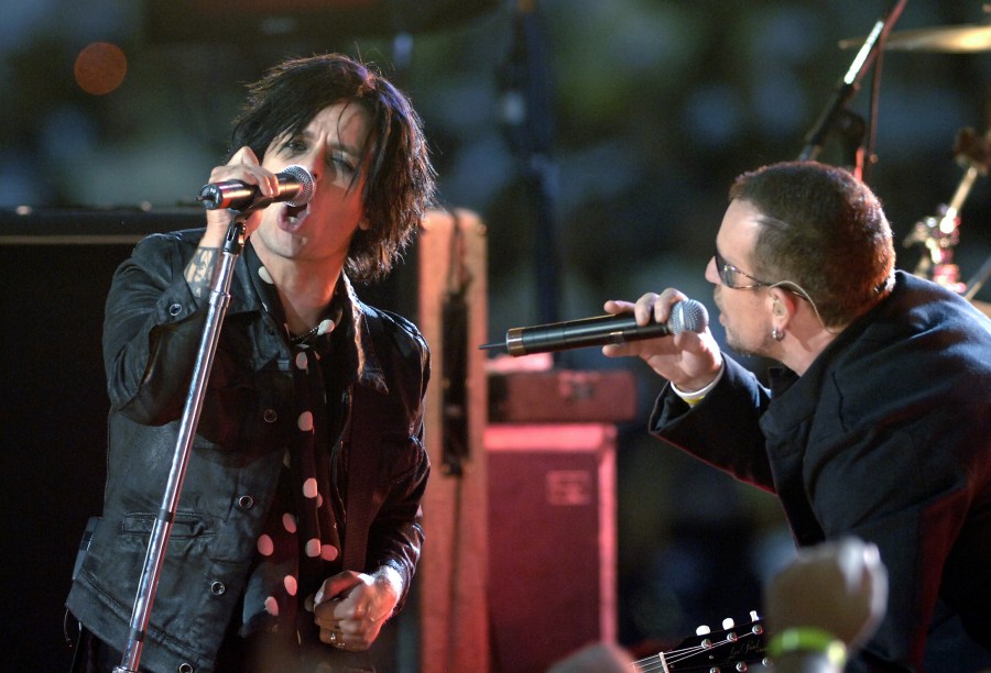 Billie Joe Armstrong of Green Day and Bono of U2 sings during a pre-game concert inside the Louisana Superdome on Sept. 25, 2006 in New Orleans. (Credit: Al Messerschmidt/Getty Images)