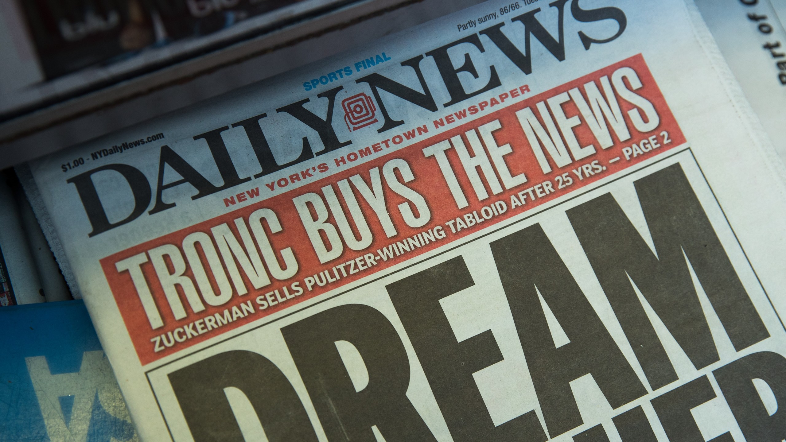 A copy of the New York Daily News sits on the shelf of a newsstand on Sept. 5, 2017 in New York City. Tronc, the publisher of the Chicago Tribune and The Los Angeles Times newspapers, announced on Monday that is had purchased The New York Daily News. (Credit: Drew Angerer/Getty Images)