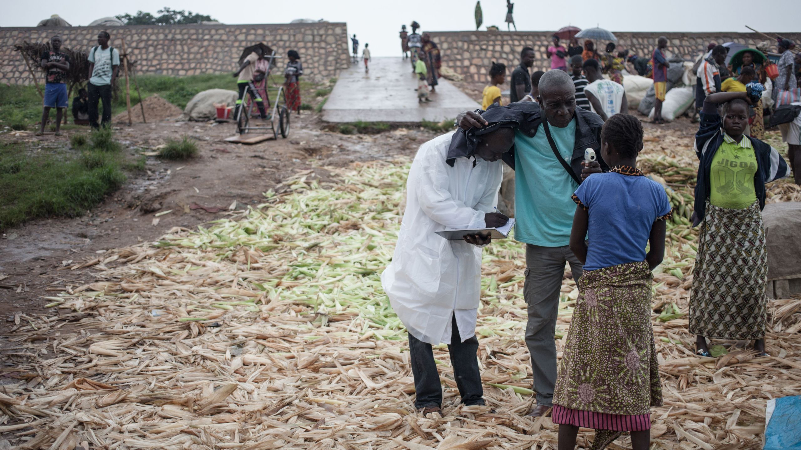 Health workers from the Ministry of Health monitor the temperature of a traveller from the Democratic Republic of Congo at each port in Bangui on June 3, 2018. (Credit: Florent Vergnes/AFP/Getty Images)