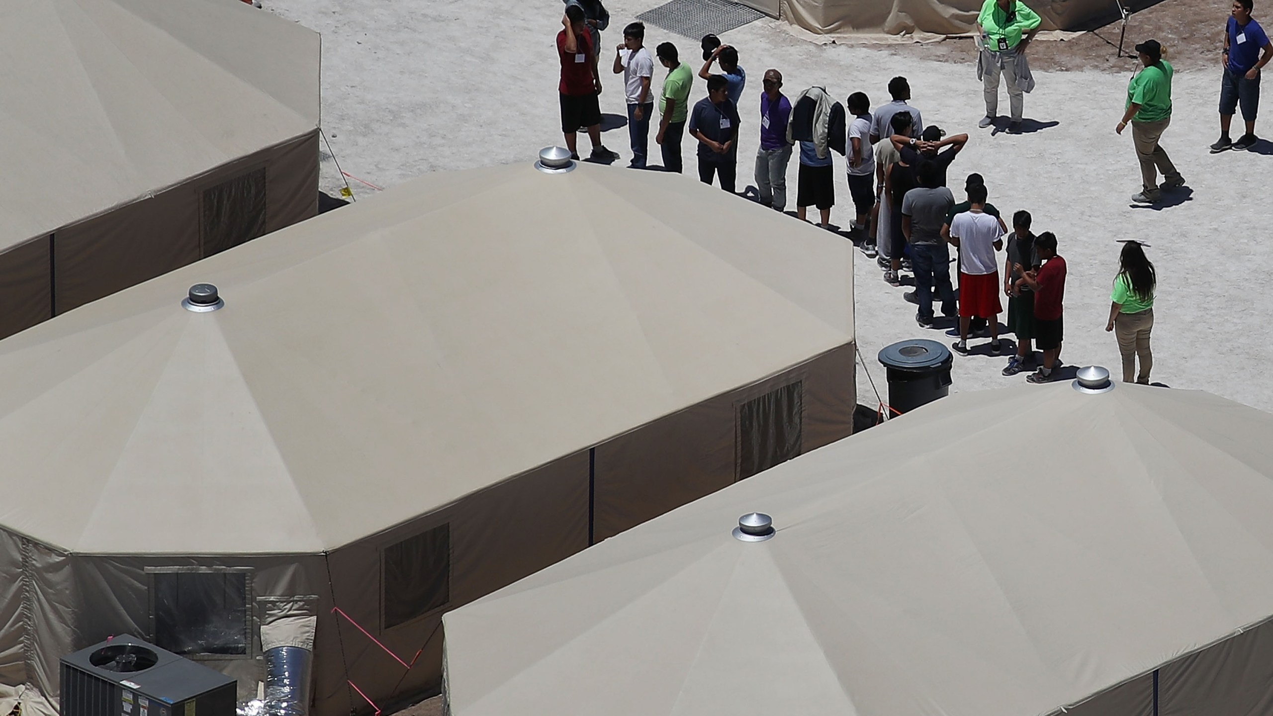 Children and workers are seen at a tent encampment built near the Tornillo Port of Entry in Texas on June 19, 2018. (Credit: Joe Raedle / Getty Images)