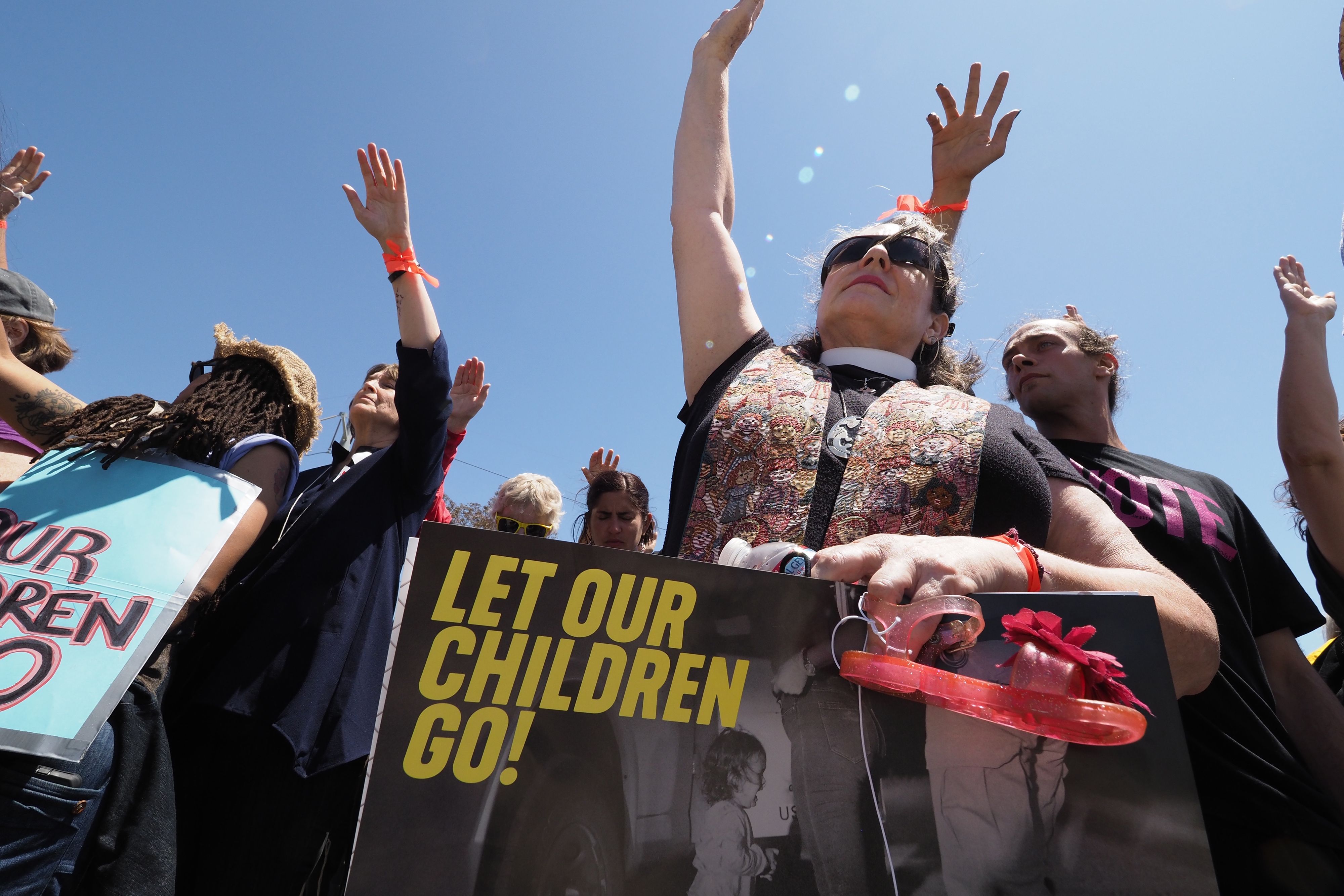 Protestors pray outside the Otay Mesa Detention Center during a demonstration against U.S. immigration policy that separates children from parents, in San Diego on June 23, 2018. (Credit: ROBYN BECK/AFP/Getty Images)